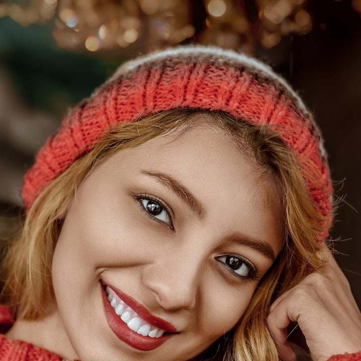 Kaveri Mehta, Lead Design Curator at HarvestBrookDune, reviewing corporate floral arrangements